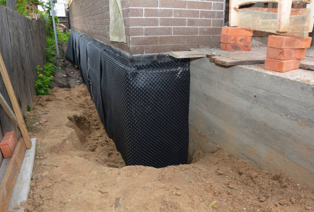 SJ Waterproofing Pros technician performing targeted Interior Drainage System assessment in Gallion, AL
